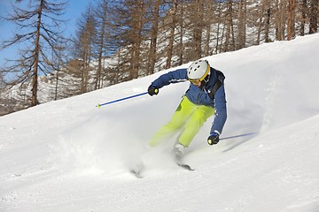 Image showing skiing on fresh snow at winter season at beautiful sunny day