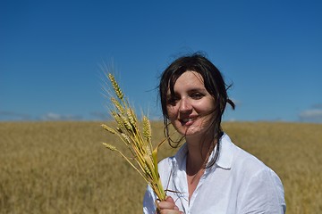 Image showing young woman in wheat field at summer