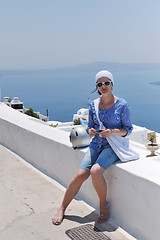 Image showing Greek woman on the streets of Oia, Santorini, Greece