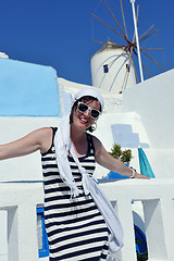 Image showing Greek woman on the streets of Oia, Santorini, Greece