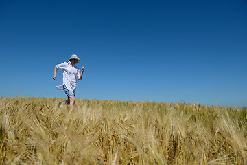 Image showing young woman in wheat field at summer