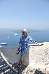 Image showing Greek woman on the streets of Oia, Santorini, Greece