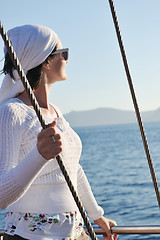 Image showing Greek woman on the streets of Oia, Santorini, Greece