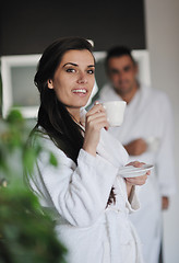 Image showing Young love couple taking fresh morning cup of coffee