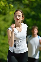 Image showing Young couple jogging at morning