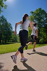 Image showing Young couple jogging at morning