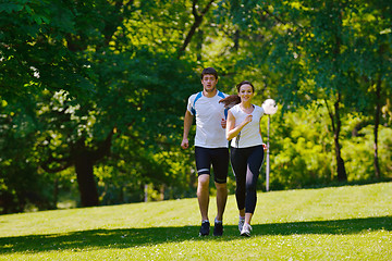 Image showing Young couple jogging