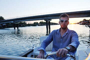 Image showing portrait of happy young man on boat