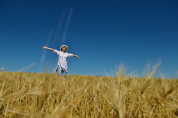 Image showing young woman in wheat field at summer