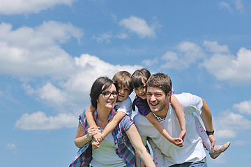 Image showing happy young family have fun outdoors