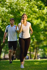 Image showing Young couple jogging