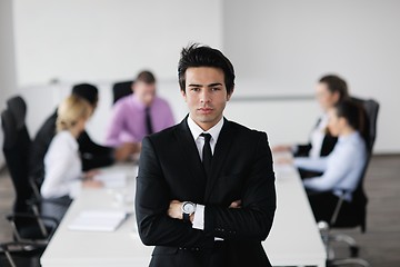 Image showing young business man at meeting