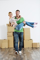 Image showing Young couple moving in new house