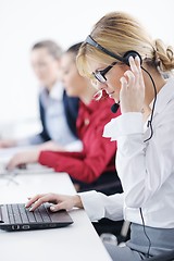 Image showing business woman group with headphones