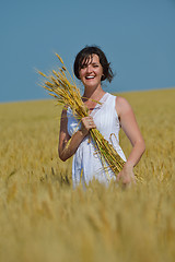 Image showing young woman in wheat field at summer