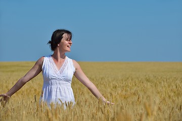 Image showing young woman in wheat field at summer