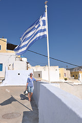 Image showing Greek woman on the streets of Oia, Santorini, Greece