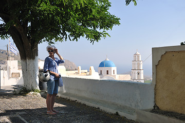 Image showing Greek woman on the streets of Oia, Santorini, Greece