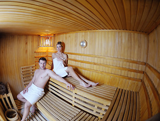 Image showing happy young couple in sauna