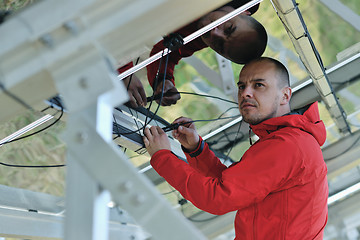 Image showing Male solar panel engineer at work place