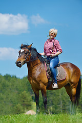 Image showing happy woman  on  horse