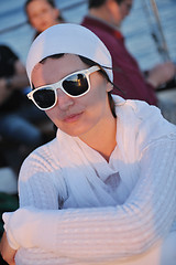 Image showing Greek woman on the streets of Oia, Santorini, Greece