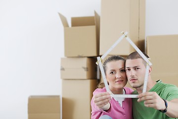 Image showing Young couple moving in new house