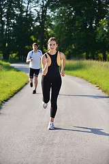 Image showing Young couple jogging