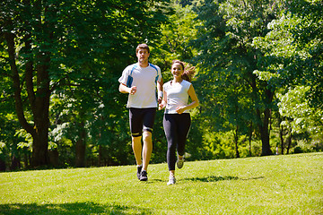 Image showing Young couple jogging