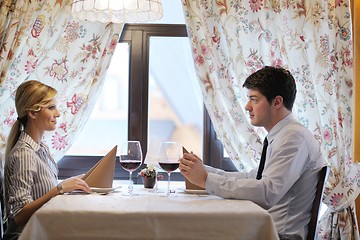 Image showing young couple having dinner at a restaurant