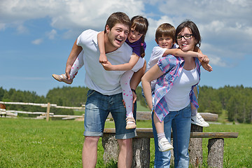 Image showing happy young family have fun outdoors