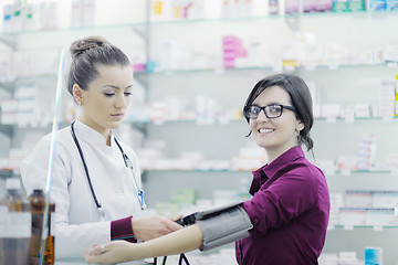 Image showing Checking blood pressure and heart rate