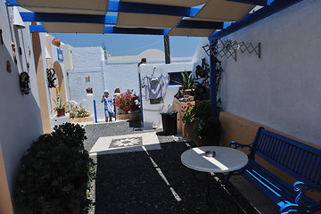 Image showing Greek woman on the streets of Oia, Santorini, Greece