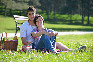 Image showing happy young couple having a picnic outdoor