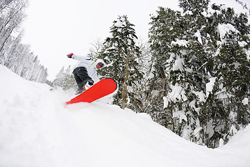 Image showing snowboarder on fresh deep snow