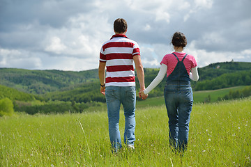 Image showing Portrait of romantic young couple smiling together outdoor