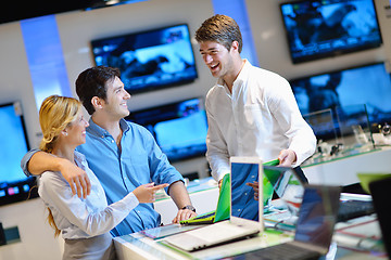 Image showing Young couple in consumer electronics store