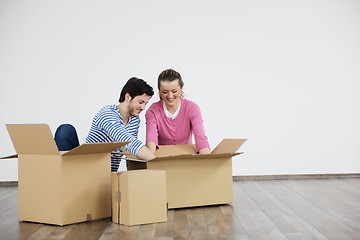 Image showing Young couple moving in new home