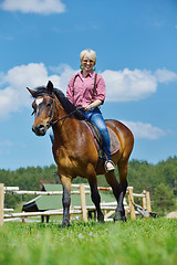 Image showing happy woman  ride  horse