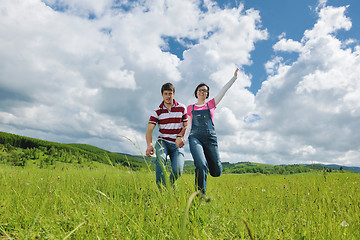 Image showing Portrait of romantic young couple smiling together outdoor