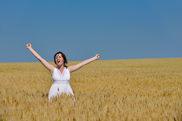 Image showing young woman in wheat field at summer