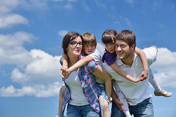 Image showing happy young family have fun outdoors