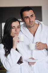 Image showing Young love couple taking fresh morning cup of coffee