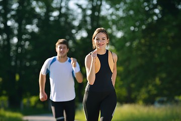 Image showing Young couple jogging