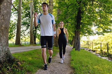 Image showing Young couple jogging