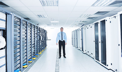 Image showing young it engeneer in datacenter server room