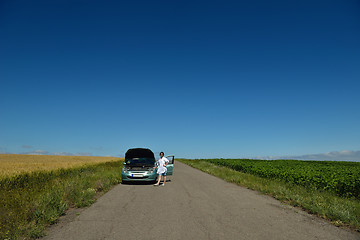 Image showing woman with broken car