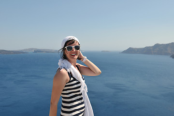 Image showing Greek woman on the streets of Oia, Santorini, Greece