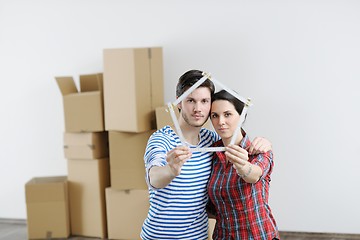 Image showing Young couple moving in new house