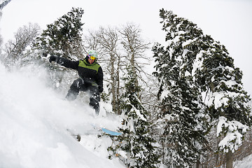 Image showing snowboarder on fresh deep snow